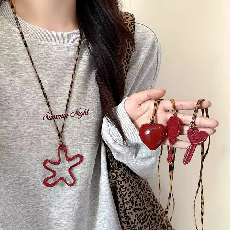 New Red Hollow Flower Necklace Heart Shaped Key Pendant Geometric Personality Leopard Leather Rope Necklace Women Sweater Chain